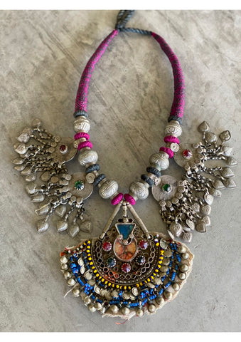 Coloured feature amulet.
